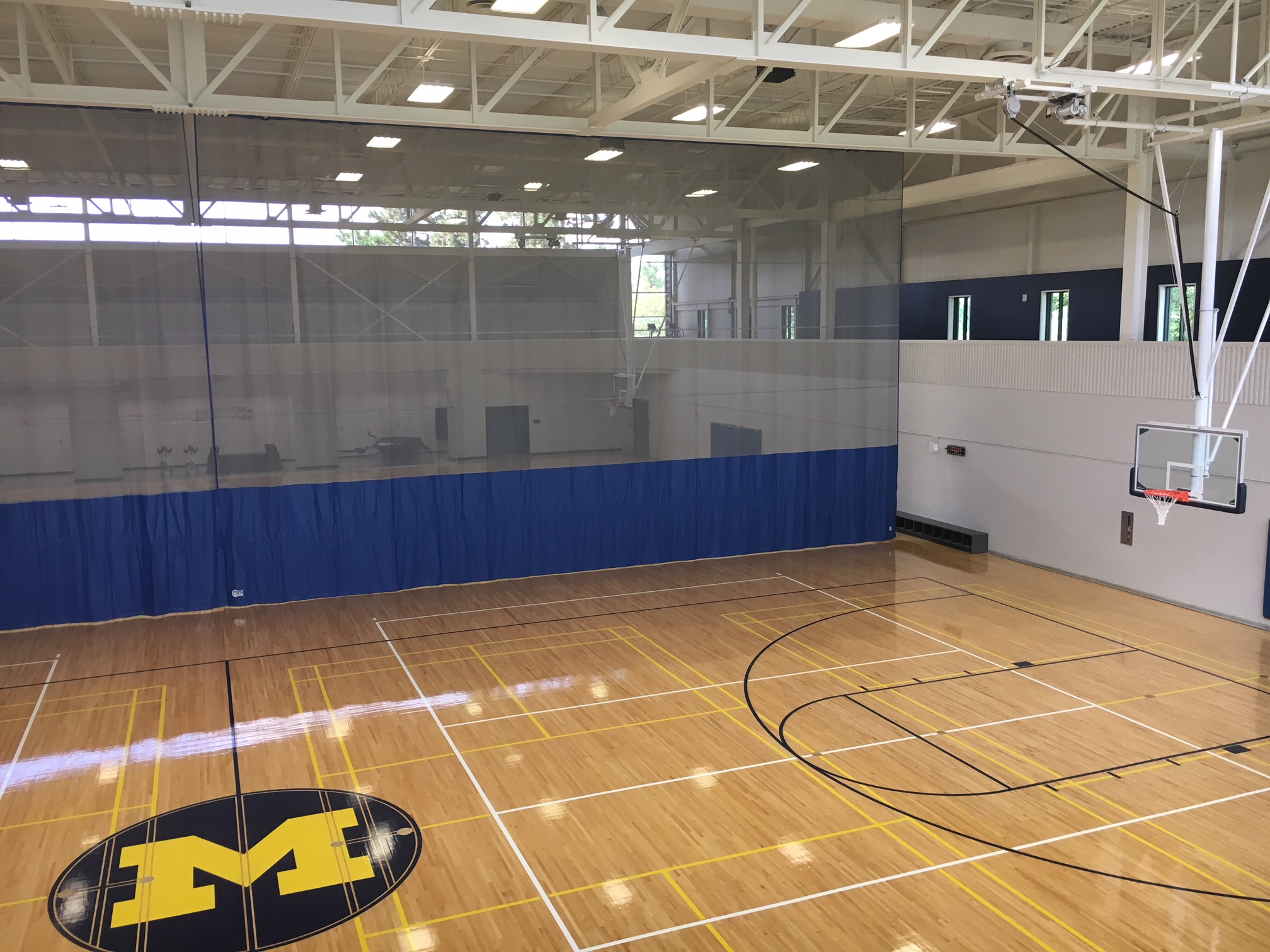 Gym divider curtain install — University of Michigan North Campus Recreation Building